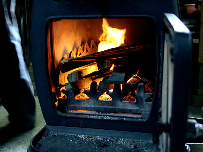 Burning wood from an old Whiskey Barrel. This wood was originally a Whiskey Barrel. Glaze for this teacup is made from the ash of this wood.